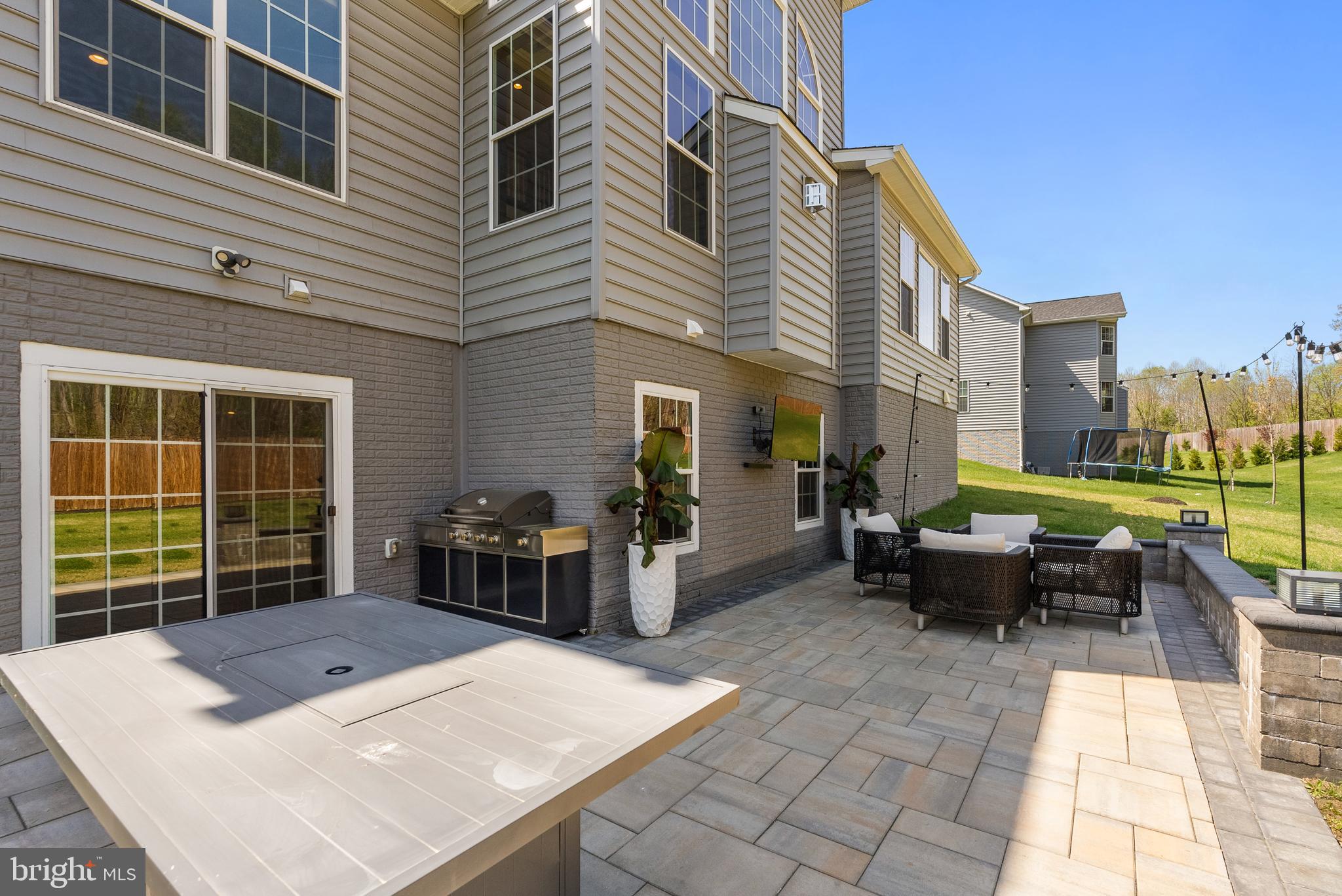 4012 Diamondhead Avenue Bowie, MD 20721 - Photo 82 of 96 a view of a patio with couches table and chairs with wooden floor and fence