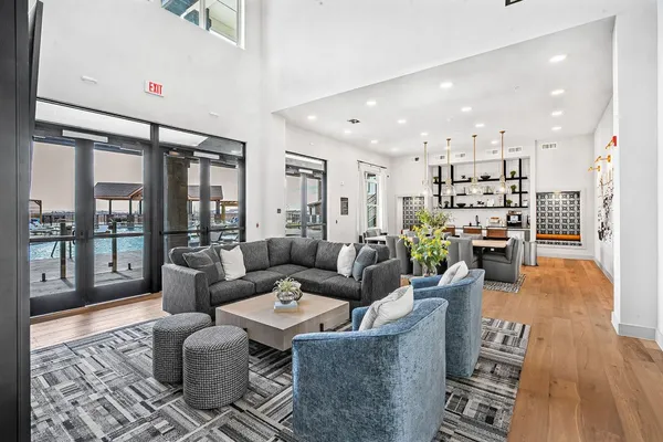 a large kitchen with kitchen island a large counter top appliances and a center island