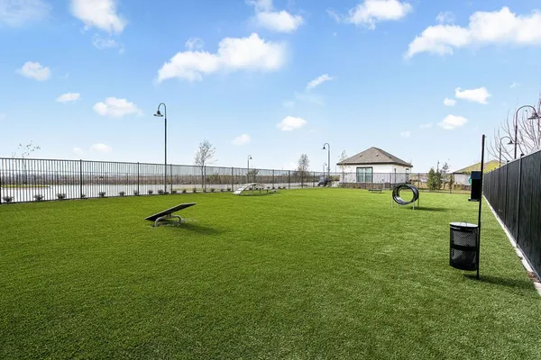 a living room with lots of furniture and gym equipment
