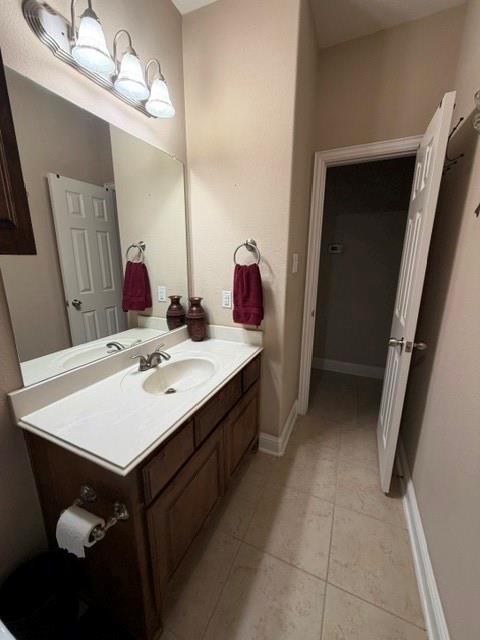 202 Tower Circle Terrell, TX 75160 - Photo 25 of 39 a bathroom with a sink vanity and mirror