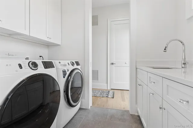 a utility room with dryer and washer