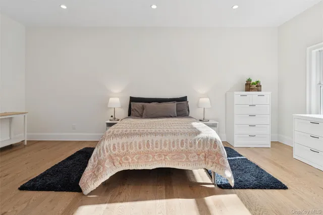 a bedroom with a bed and a dresser