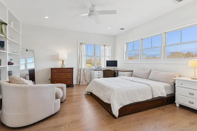 a bedroom with a bed and a couch