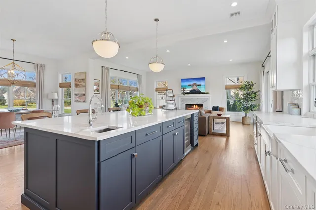 a kitchen with counter top space a sink appliances and cabinets