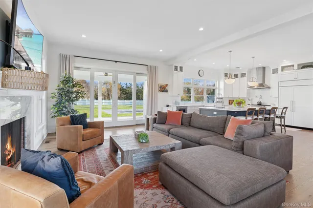a living room with furniture fireplace and a flat screen tv