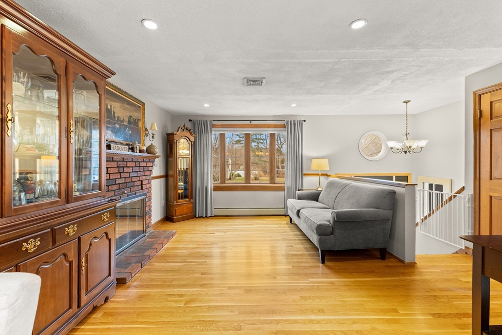 70 Dillingham Way Hanover, MA 02339 - Photo 11 of 42 a living room with furniture and a large window