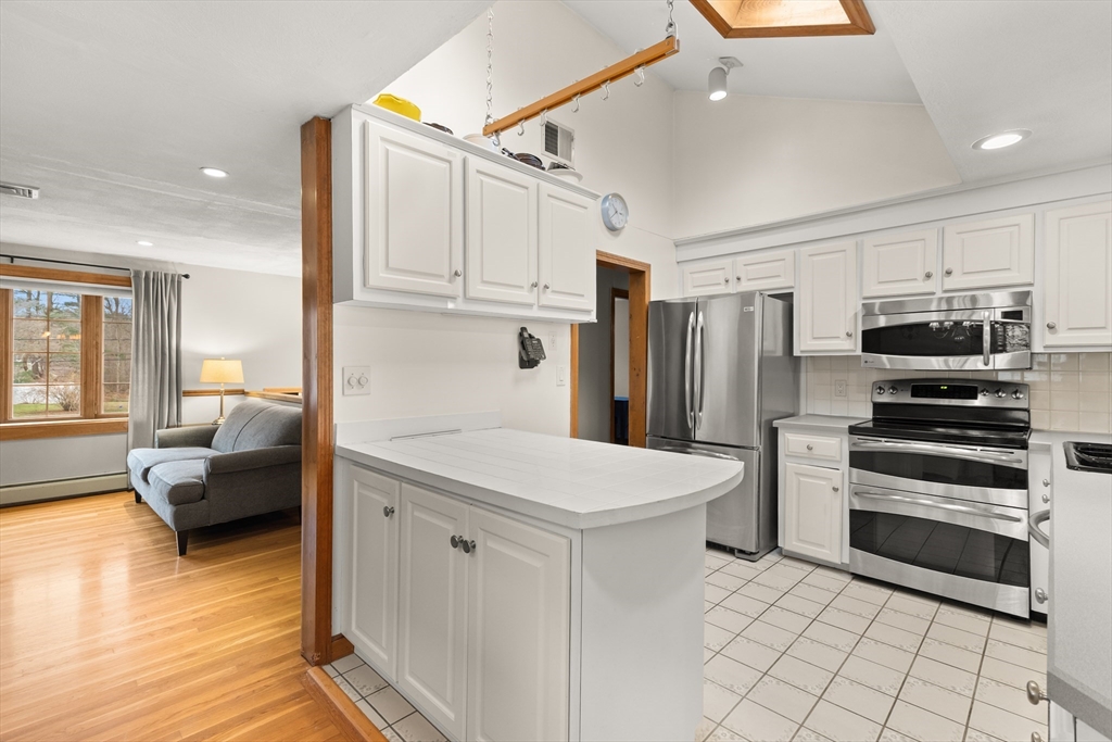 70 Dillingham Way Hanover, MA 02339 - Photo 18 of 42 a kitchen with stainless steel appliances a refrigerator sink and cabinets