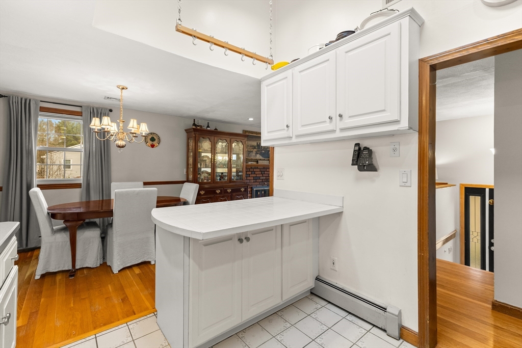 70 Dillingham Way Hanover, MA 02339 - Photo 21 of 42 a view of kitchen island with furniture and wooden floor
