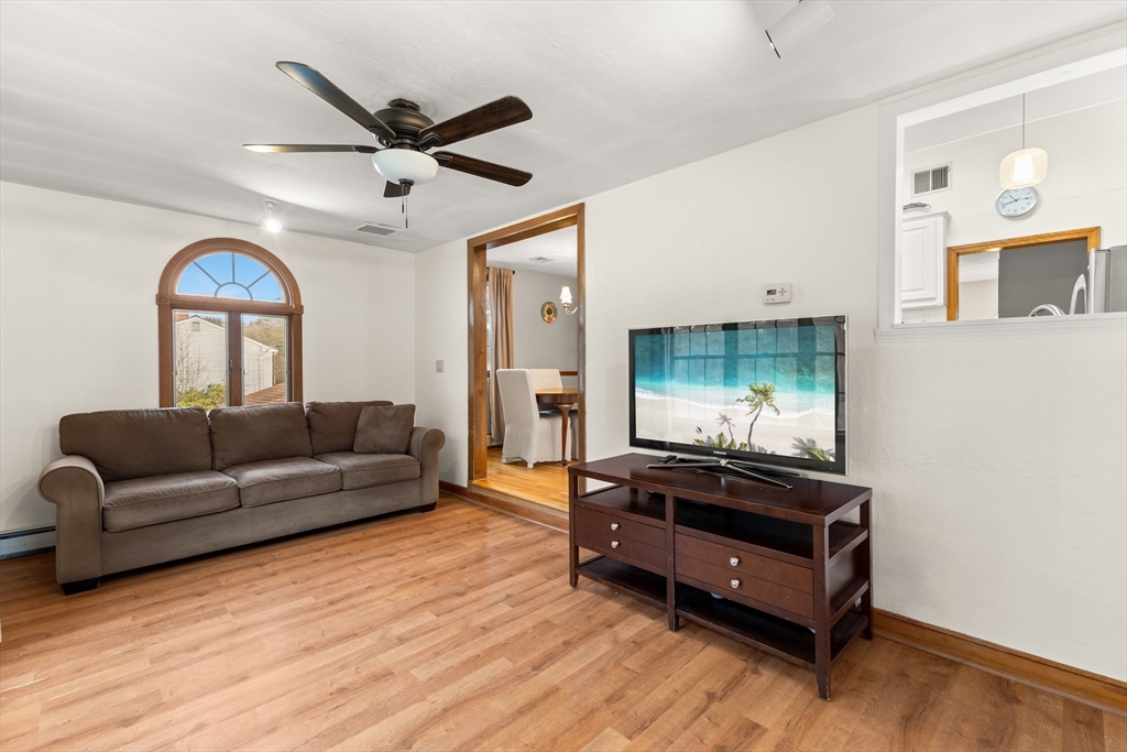 70 Dillingham Way Hanover, MA 02339 - Photo 23 of 42 a living room with furniture and a flat screen tv