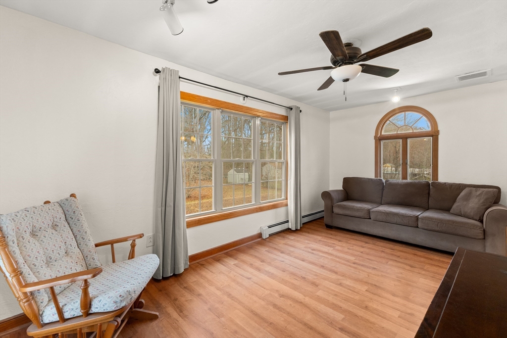 70 Dillingham Way Hanover, MA 02339 - Photo 24 of 42 a living room with furniture and a large window