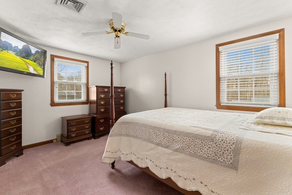 70 Dillingham Way Hanover, MA 02339 - Photo 25 of 42 a bedroom with a bed dresser and a window