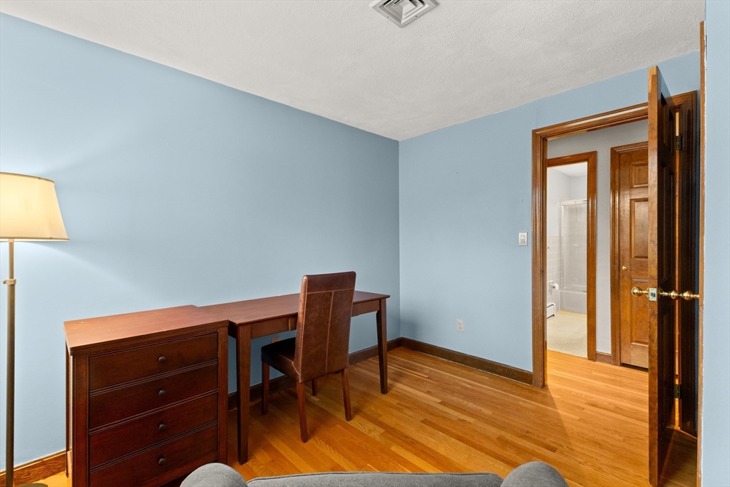 70 Dillingham Way Hanover, MA 02339 - Photo 31 of 42 a view of a workspace with furniture and wooden floor