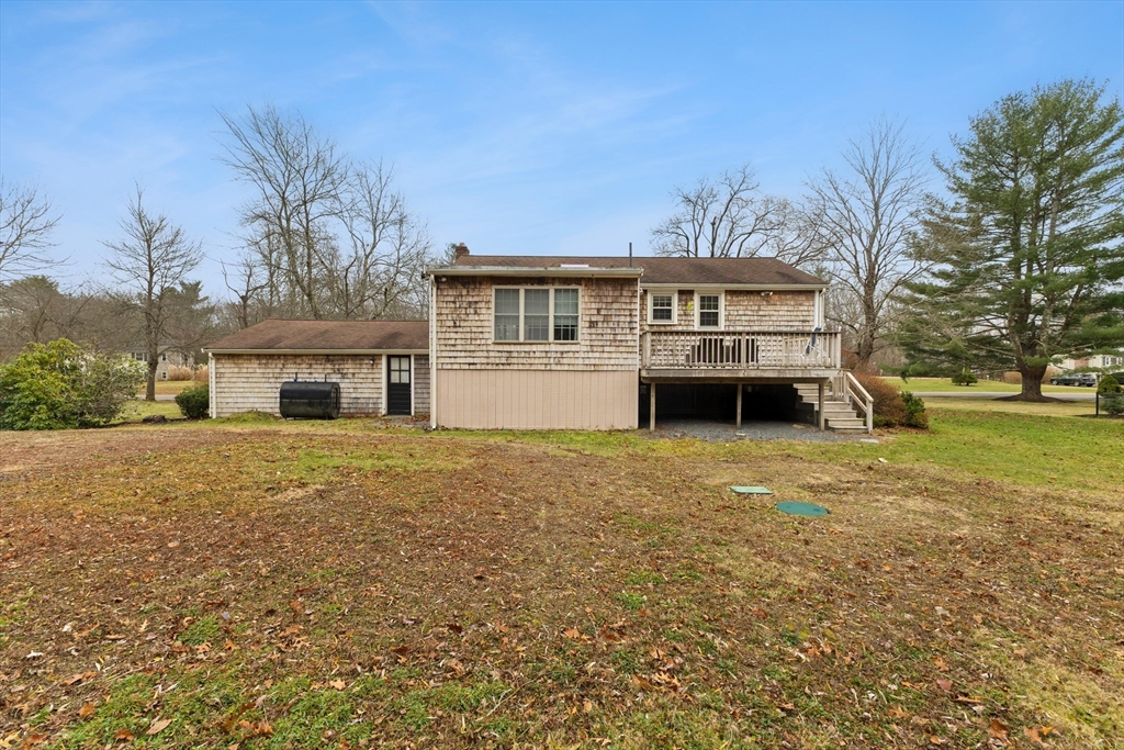 70 Dillingham Way Hanover, MA 02339 - Photo 4 of 42 a front view of a house with a garden and trees