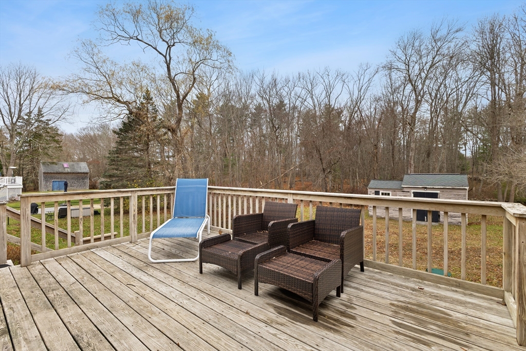 70 Dillingham Way Hanover, MA 02339 - Photo 41 of 42 a view of a balcony with wooden floor and outdoor seating