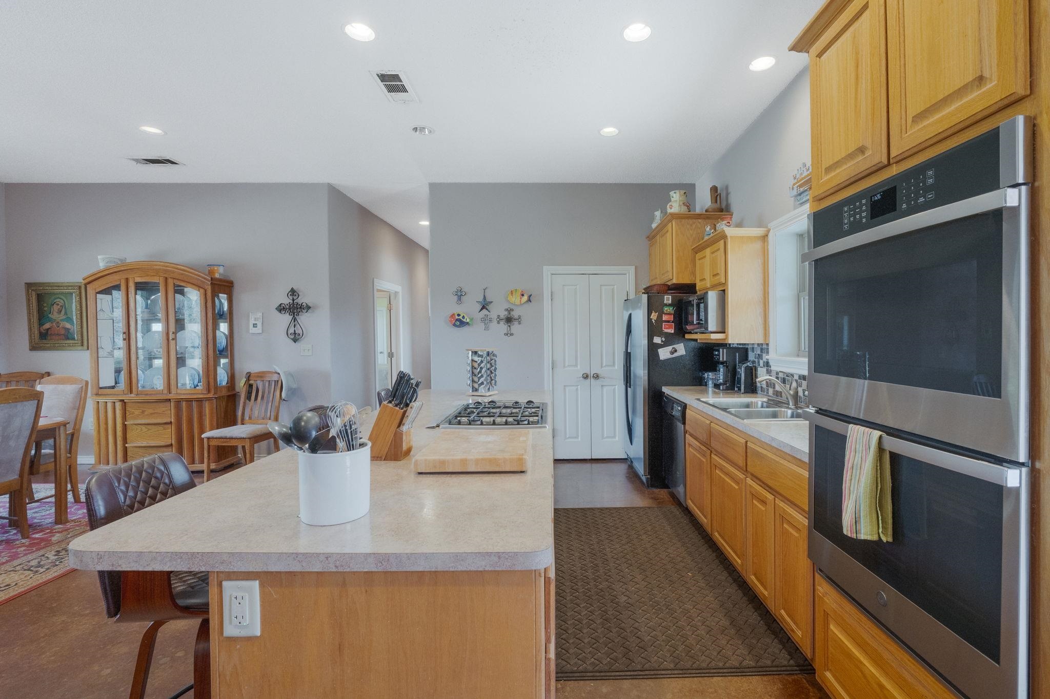 8089 East Fm 580 Kempner, TX 76539 - Photo 17 of 30 a large kitchen with a table chairs and refrigerator