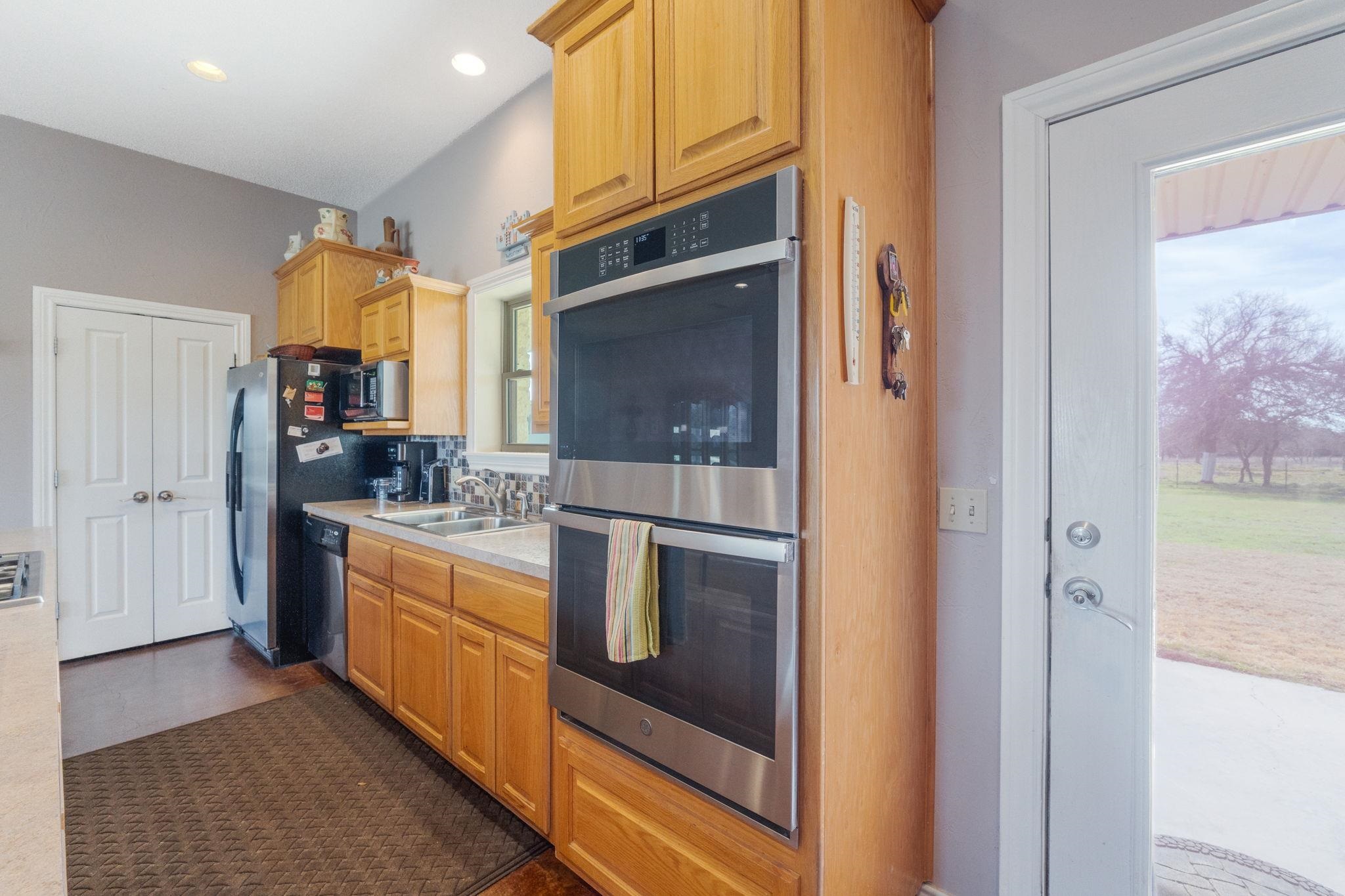 8089 East Fm 580 Kempner, TX 76539 - Photo 18 of 30 a kitchen with stainless steel appliances granite countertop a stove and a refrigerator