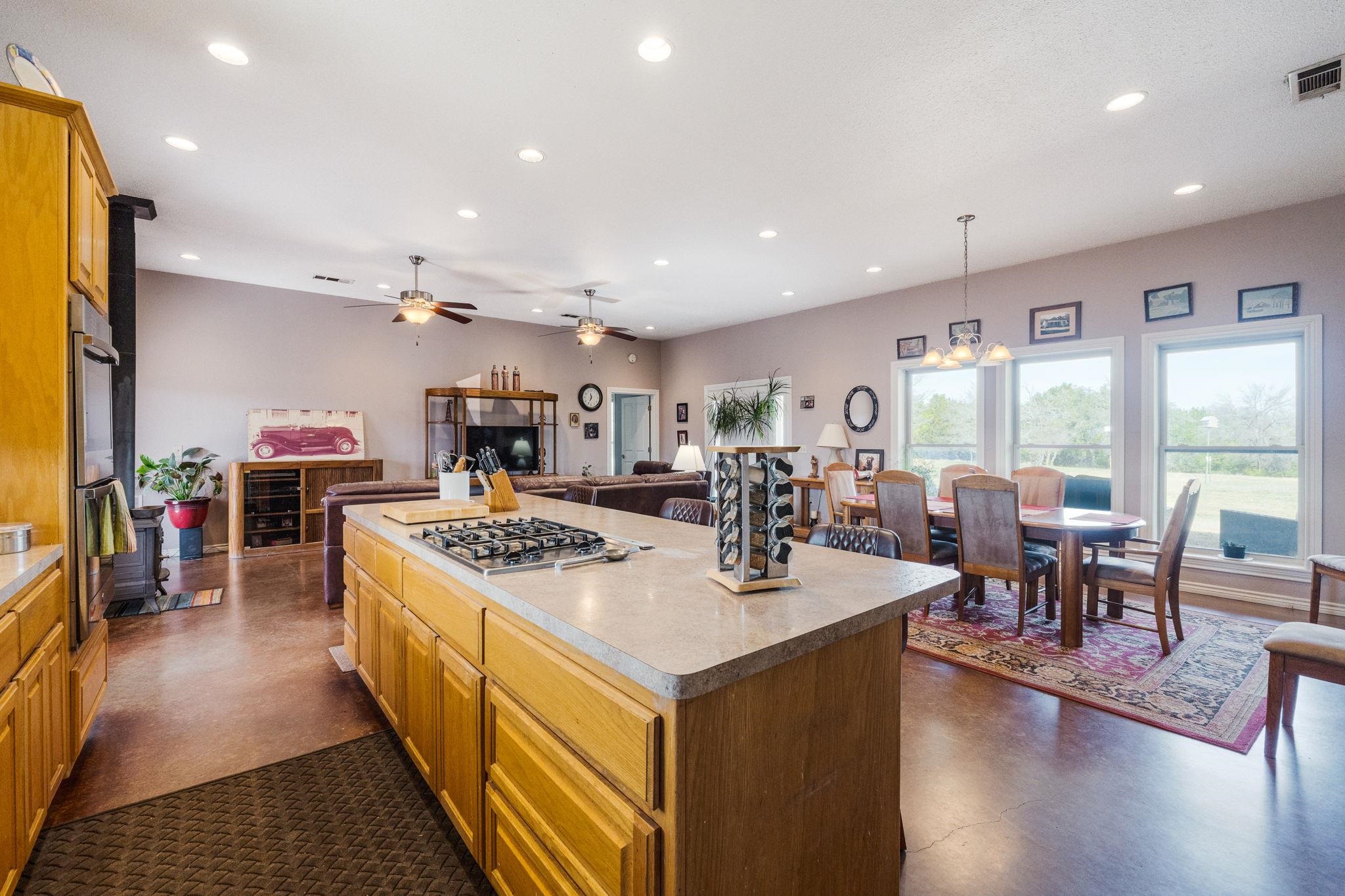 8089 East Fm 580 Kempner, TX 76539 - Photo 19 of 30 a kitchen with stainless steel appliances granite countertop a stove oven and a refrigerator