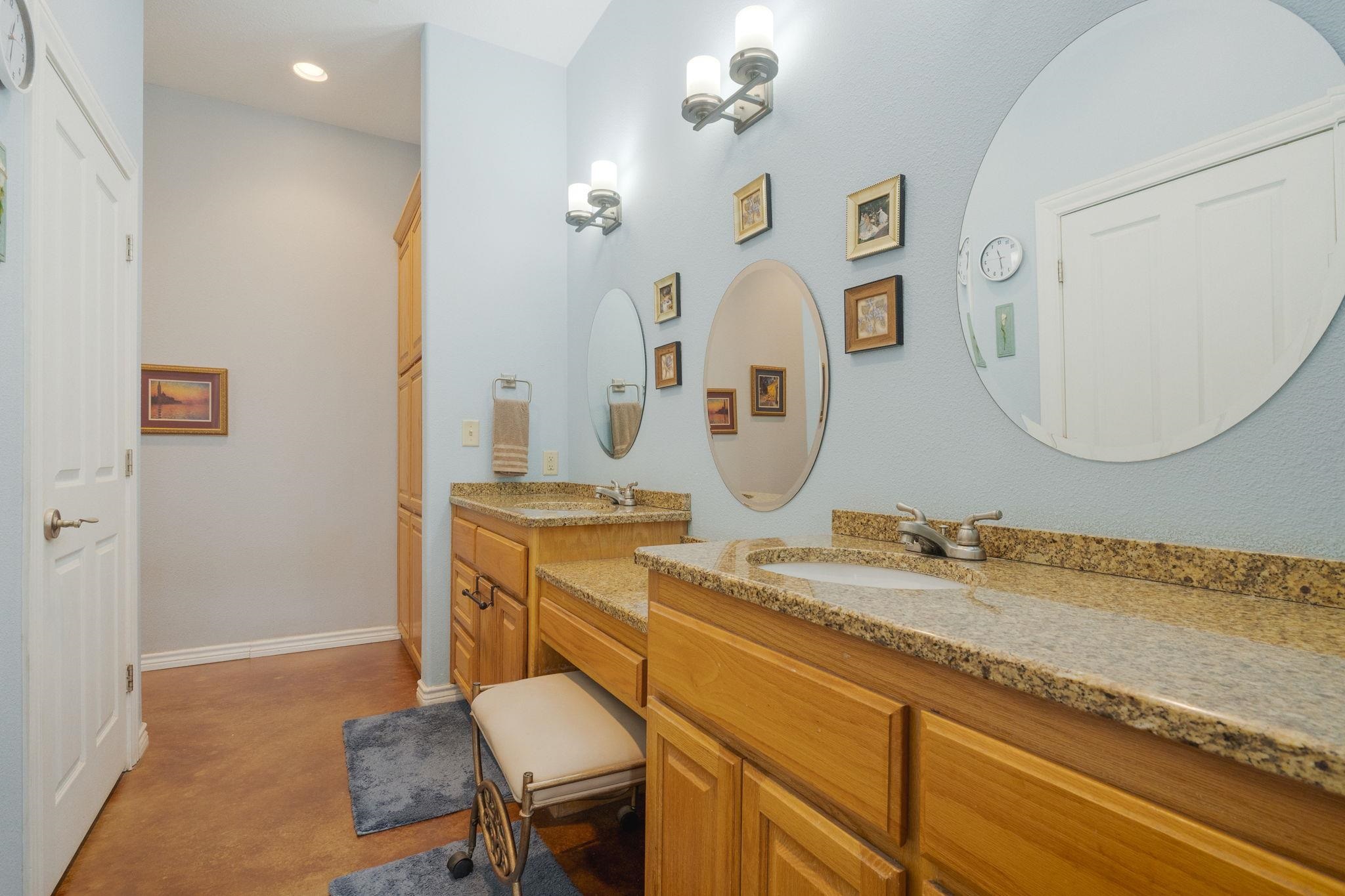 8089 East Fm 580 Kempner, TX 76539 - Photo 26 of 30 a bathroom with a granite countertop sink a mirror and vanity