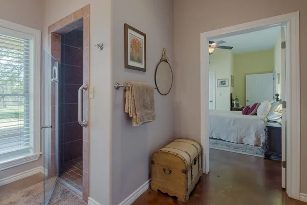 a room with a mirror and a window