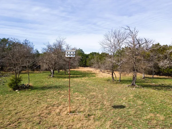 a view of a playground with basketball court
