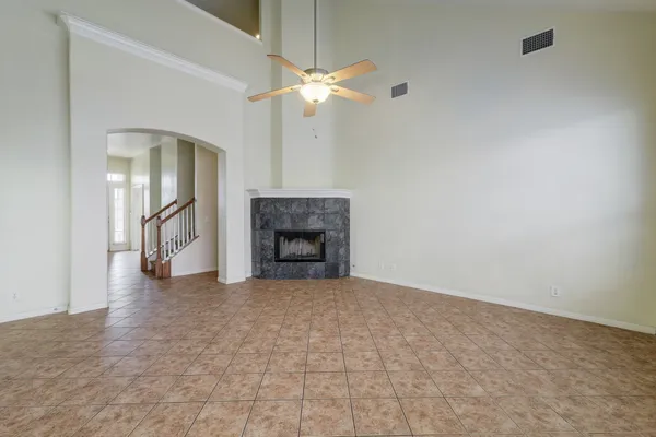 a view of an empty room with a fireplace