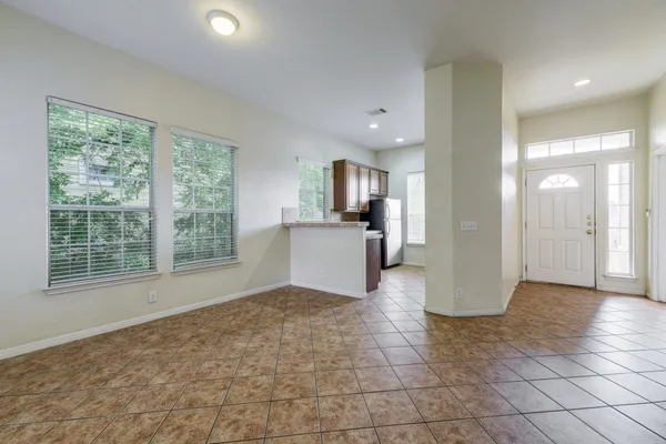 a view of a kitchen with a sink and a window