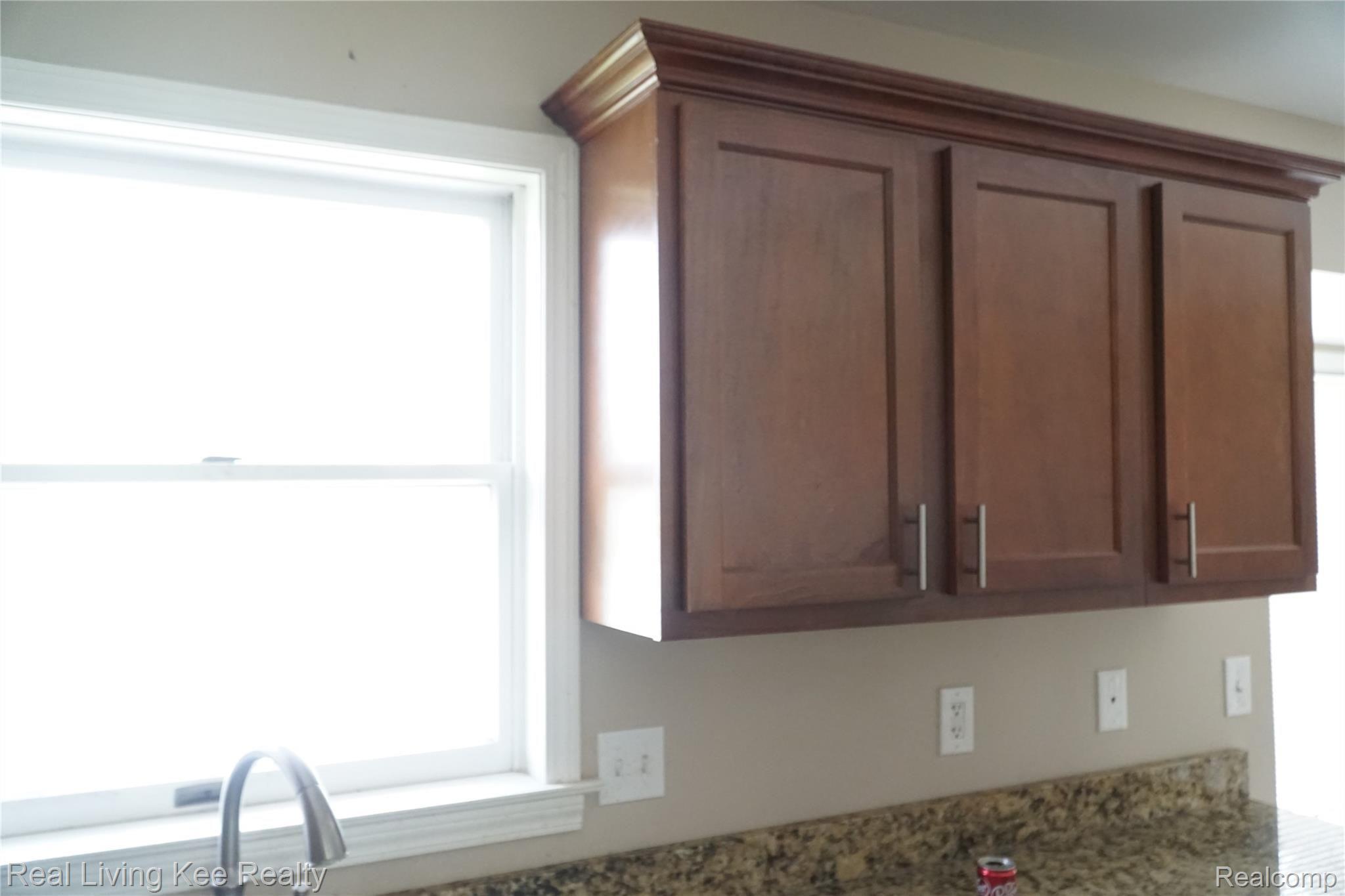 5408 South Vassar Road Grand Blanc, MI 48439 - Photo 7 of 22 Large kitchen window above sink, dining room and door wall to the right