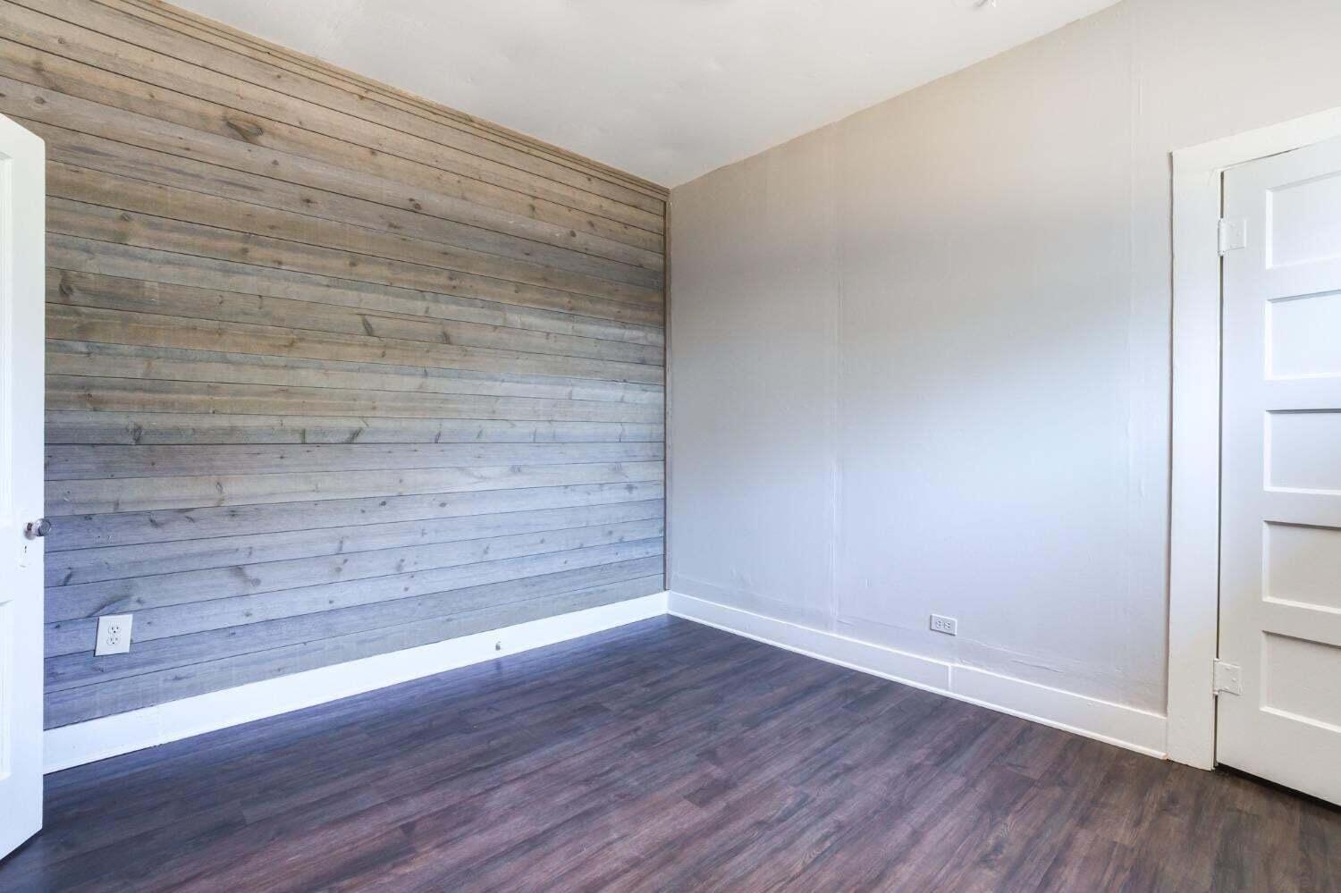 1918 18th Street Lubbock, TX 79401 - Photo 12 of 28 a view of an empty room with wooden floor