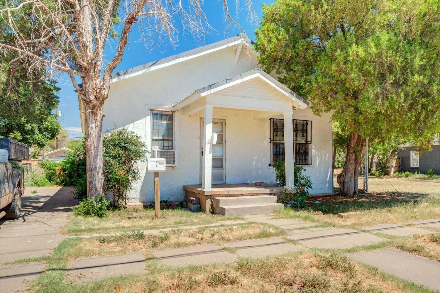 1918 18th Street Lubbock, TX 79401 - Photo 2 of 28 a front view of a house with a yard