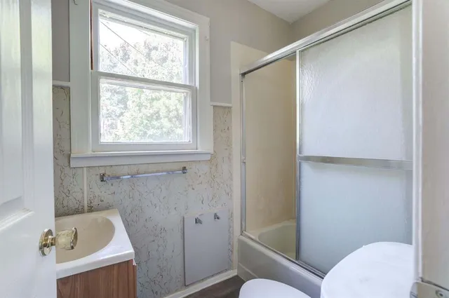 a bathroom with a tub and a shower