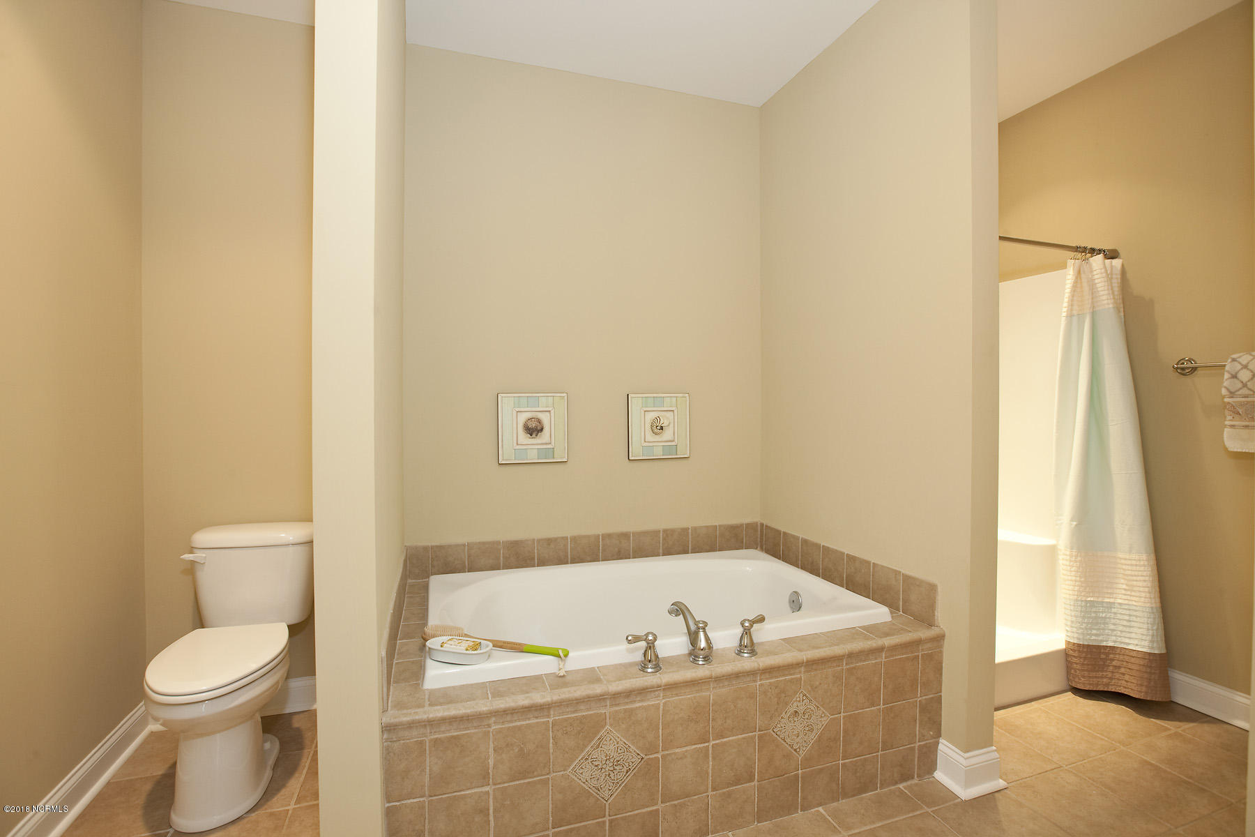 112 Spring Chase Lane Rocky Point, NC 28457 - Photo 27 of 63 Ceramic tiled floor and garden tub in the master bath.