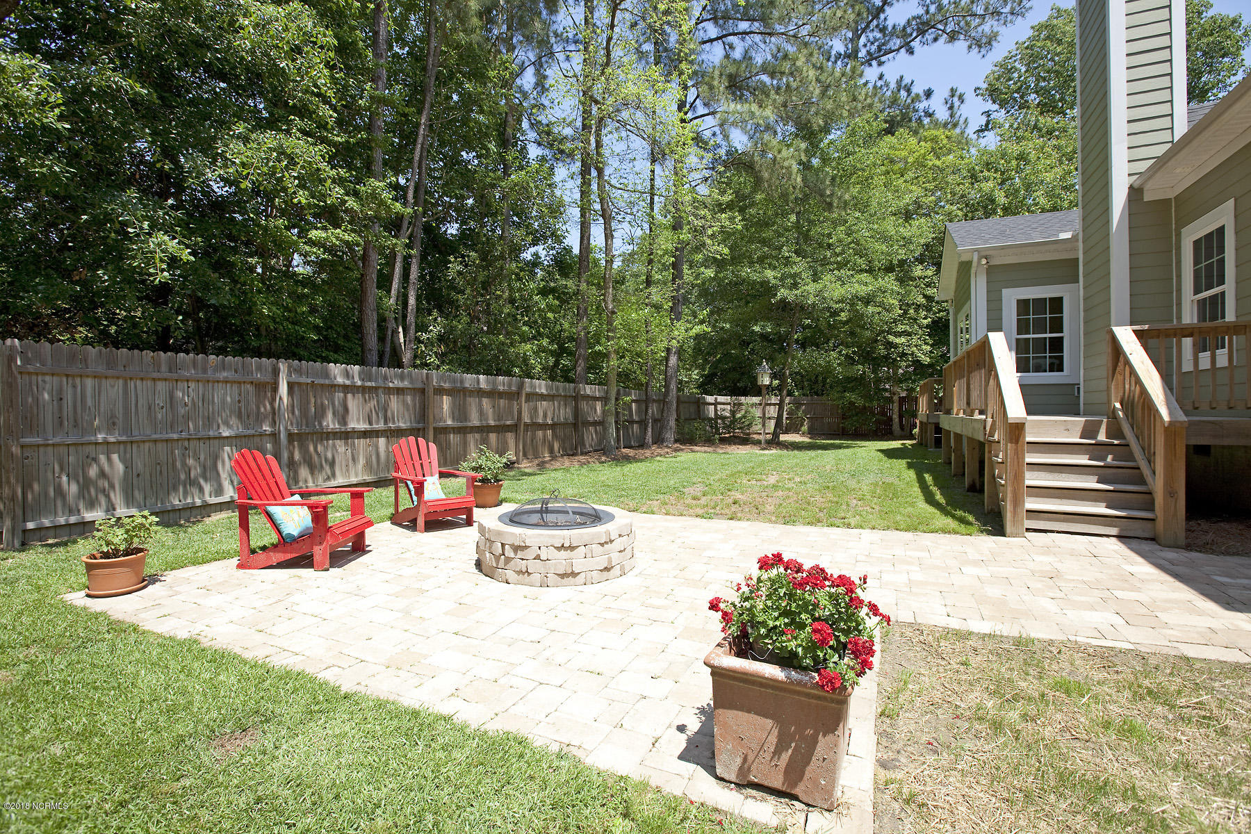 112 Spring Chase Lane Rocky Point, NC 28457 - Photo 52 of 63 Stone patio and firepit to enjoy with family and friends.