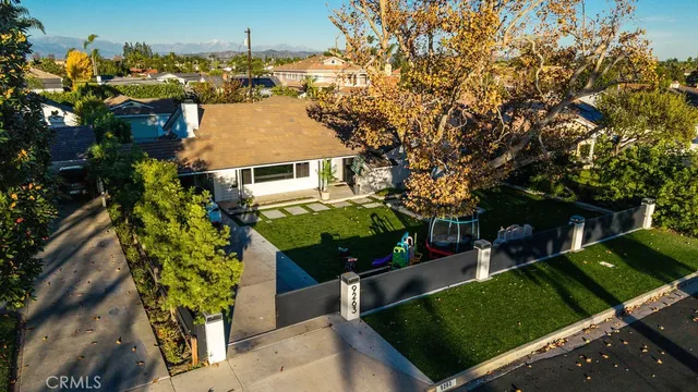 an aerial view of a house with a yard
