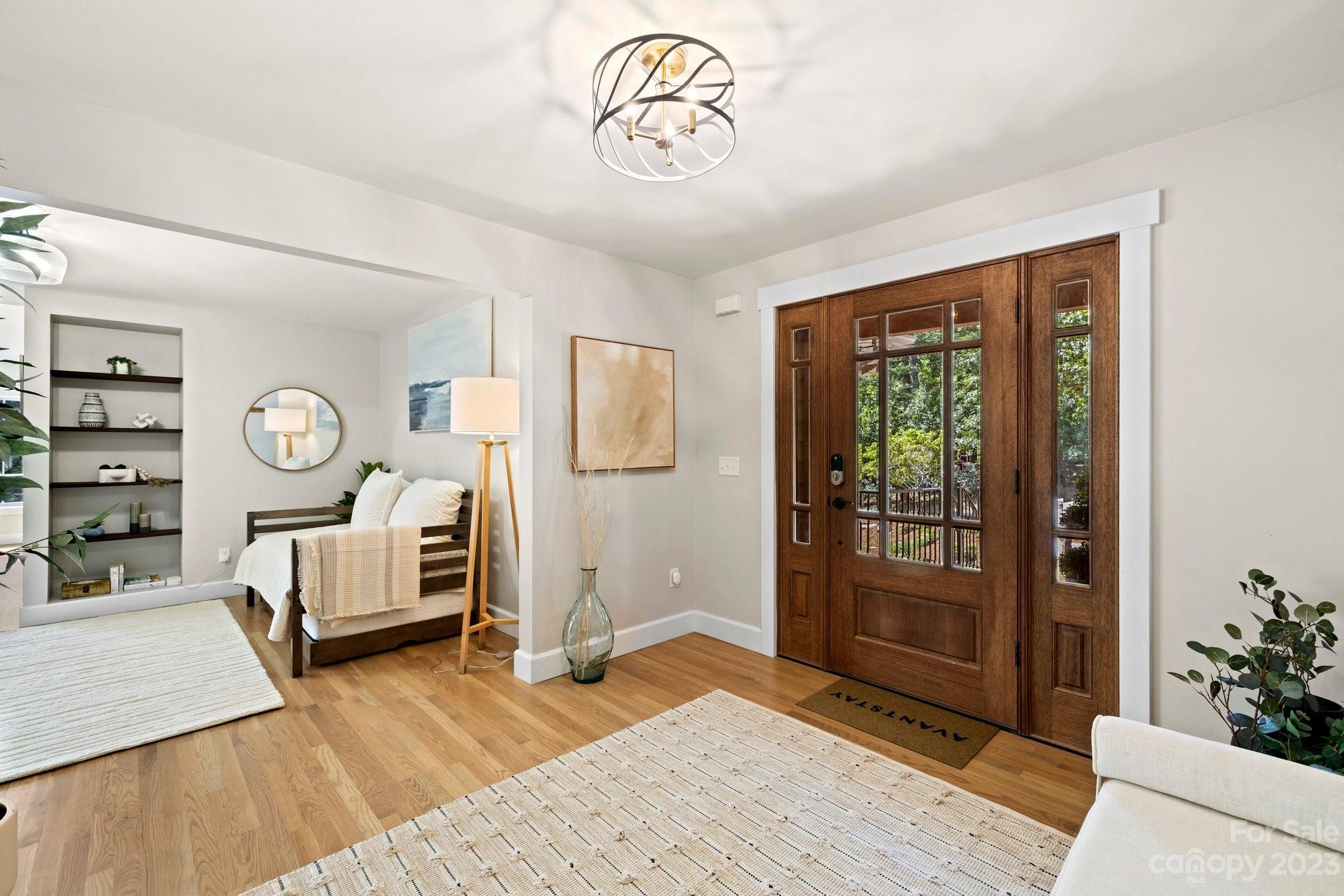 188 White Oak Gap Road Asheville, NC 28803 - Photo 14 of 48 a bedroom with furniture and a wooden floor