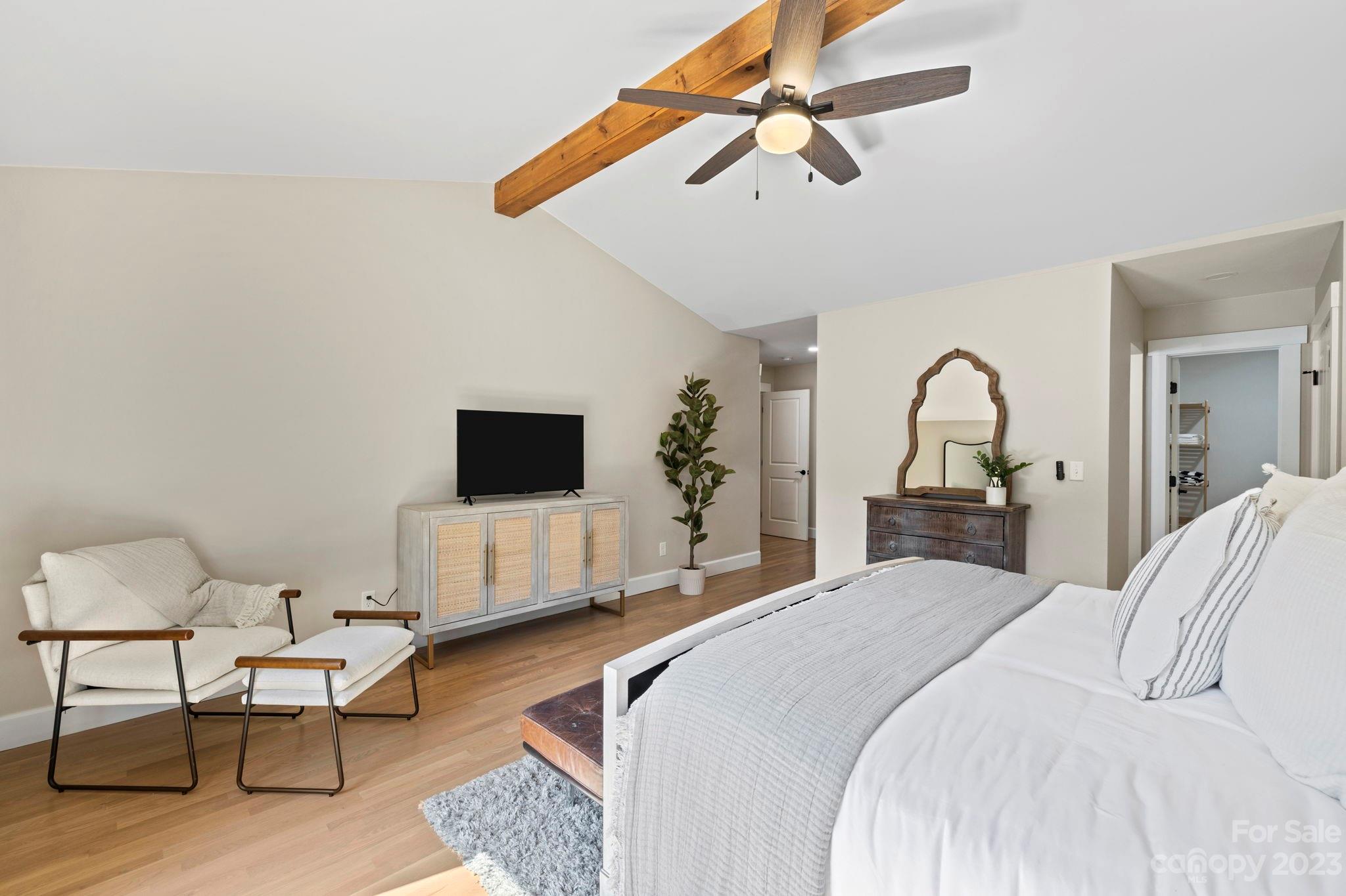 188 White Oak Gap Road Asheville, NC 28803 - Photo 19 of 48 a bedroom with a bed and a flat screen tv