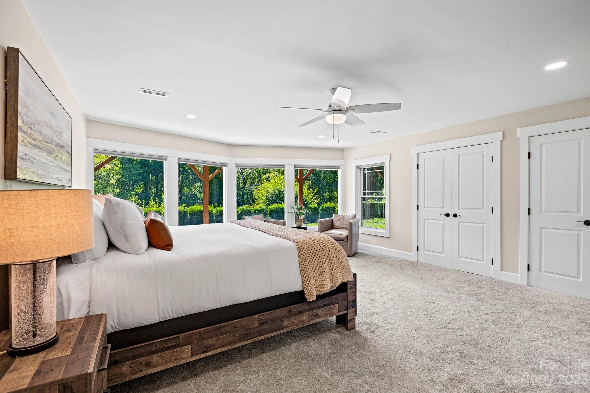 188 White Oak Gap Road Asheville, NC 28803 - Photo 24 of 48 a bed room with a bed and large window