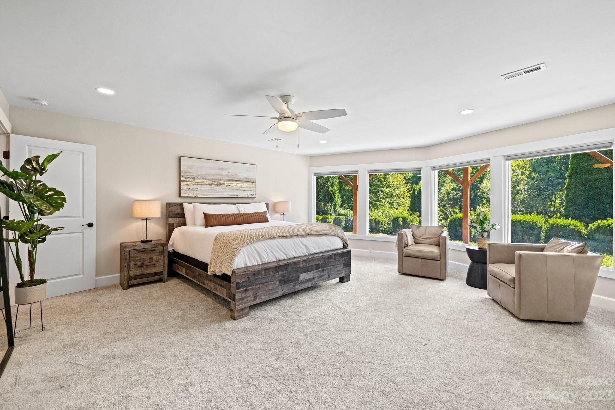 188 White Oak Gap Road Asheville, NC 28803 - Photo 26 of 48 a bedroom with a bed and large window