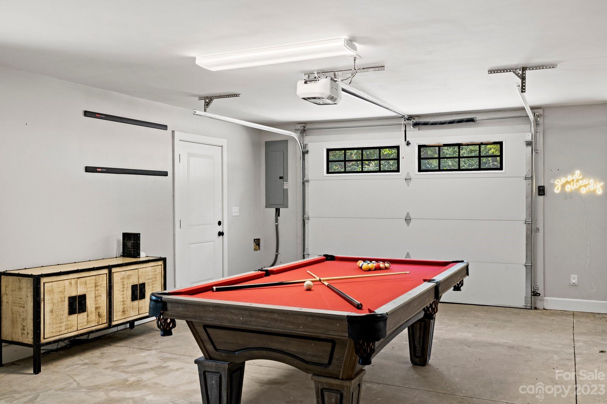 188 White Oak Gap Road Asheville, NC 28803 - Photo 32 of 48 a room with pool table and windows