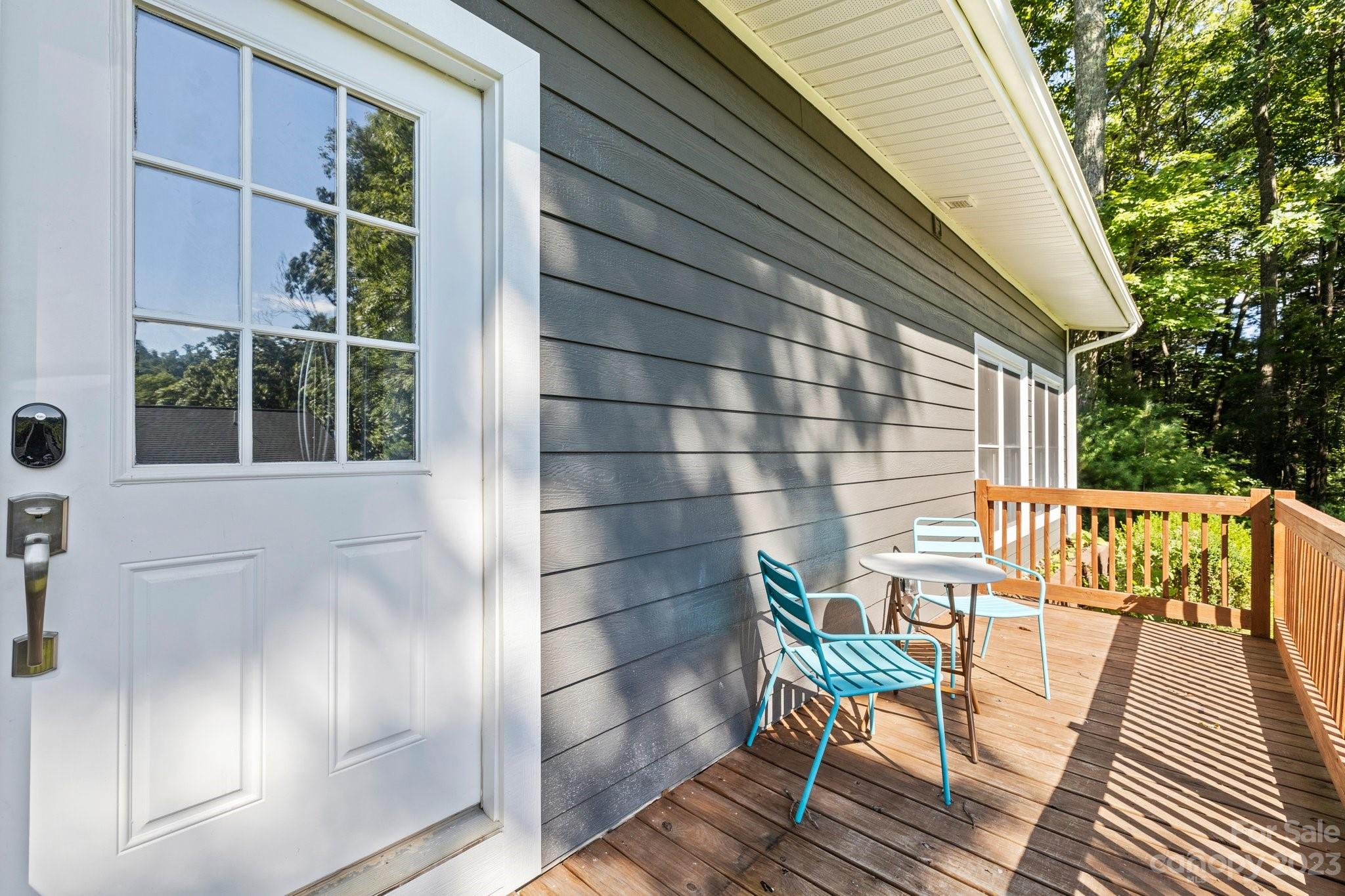 188 White Oak Gap Road Asheville, NC 28803 - Photo 36 of 48 a view of a balcony with chairs and wooden floor