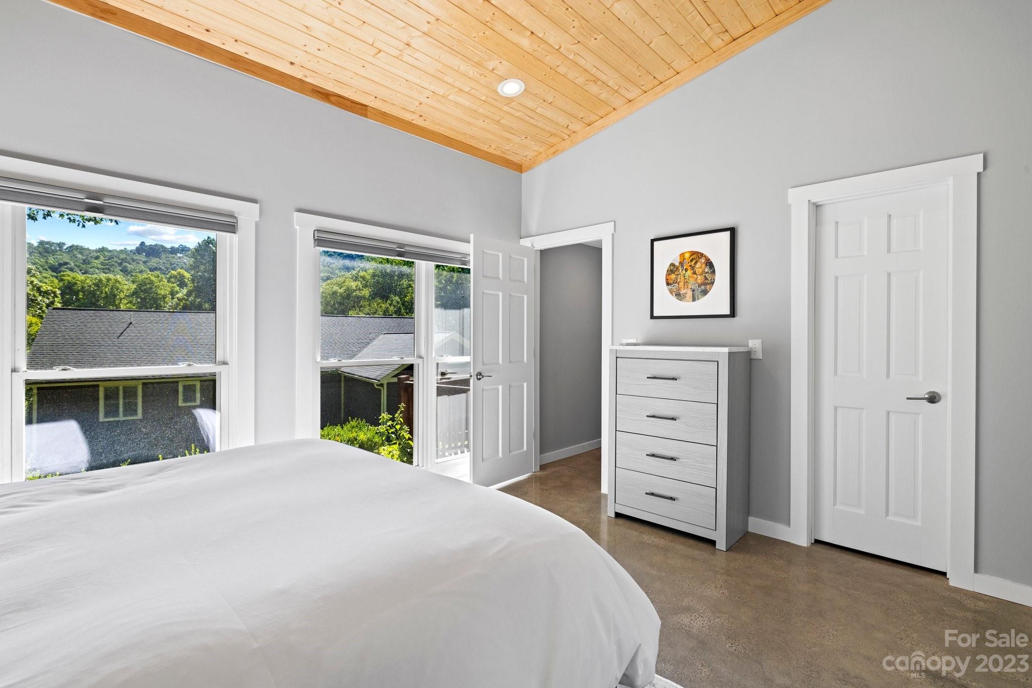 188 White Oak Gap Road Asheville, NC 28803 - Photo 42 of 48 a bedroom with a bed and a window