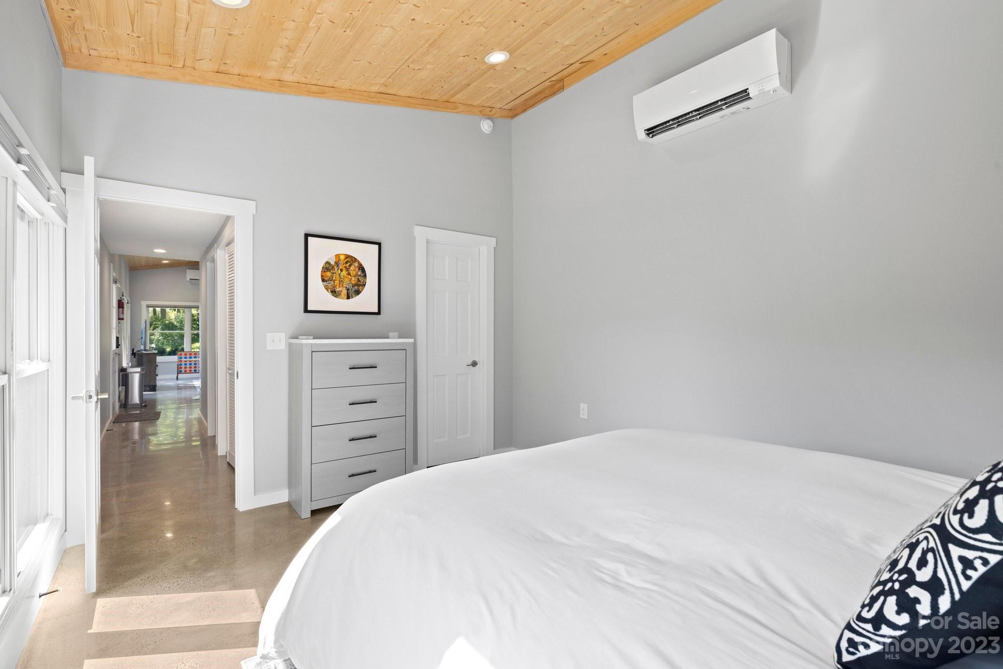 188 White Oak Gap Road Asheville, NC 28803 - Photo 43 of 48 a spacious bedroom with a bed and a cabinets