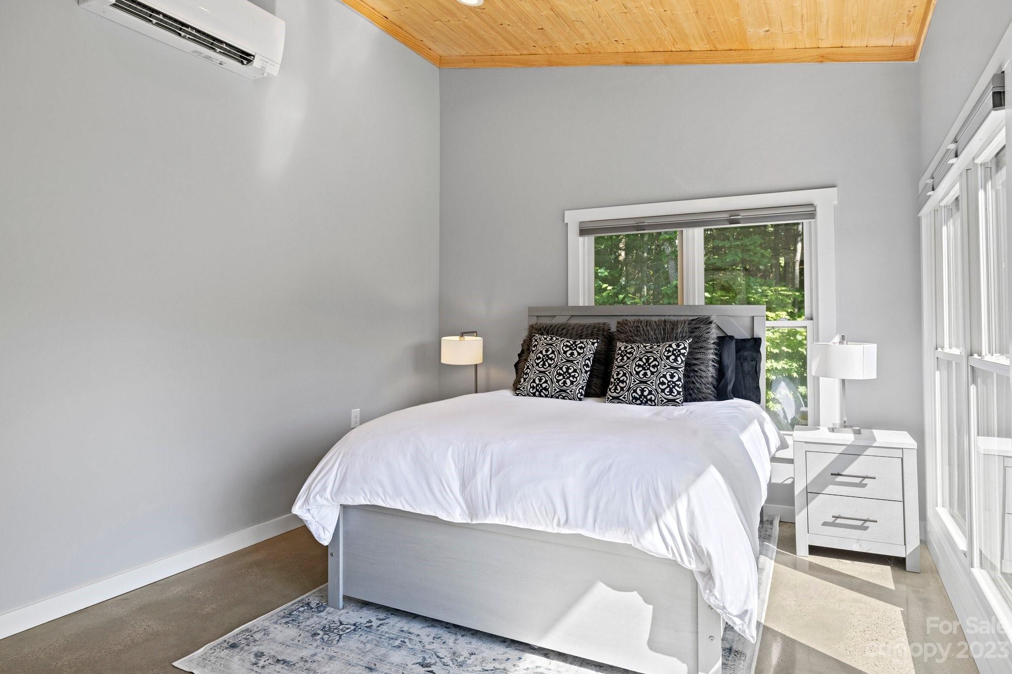188 White Oak Gap Road Asheville, NC 28803 - Photo 44 of 48 a bedroom with a bed and window