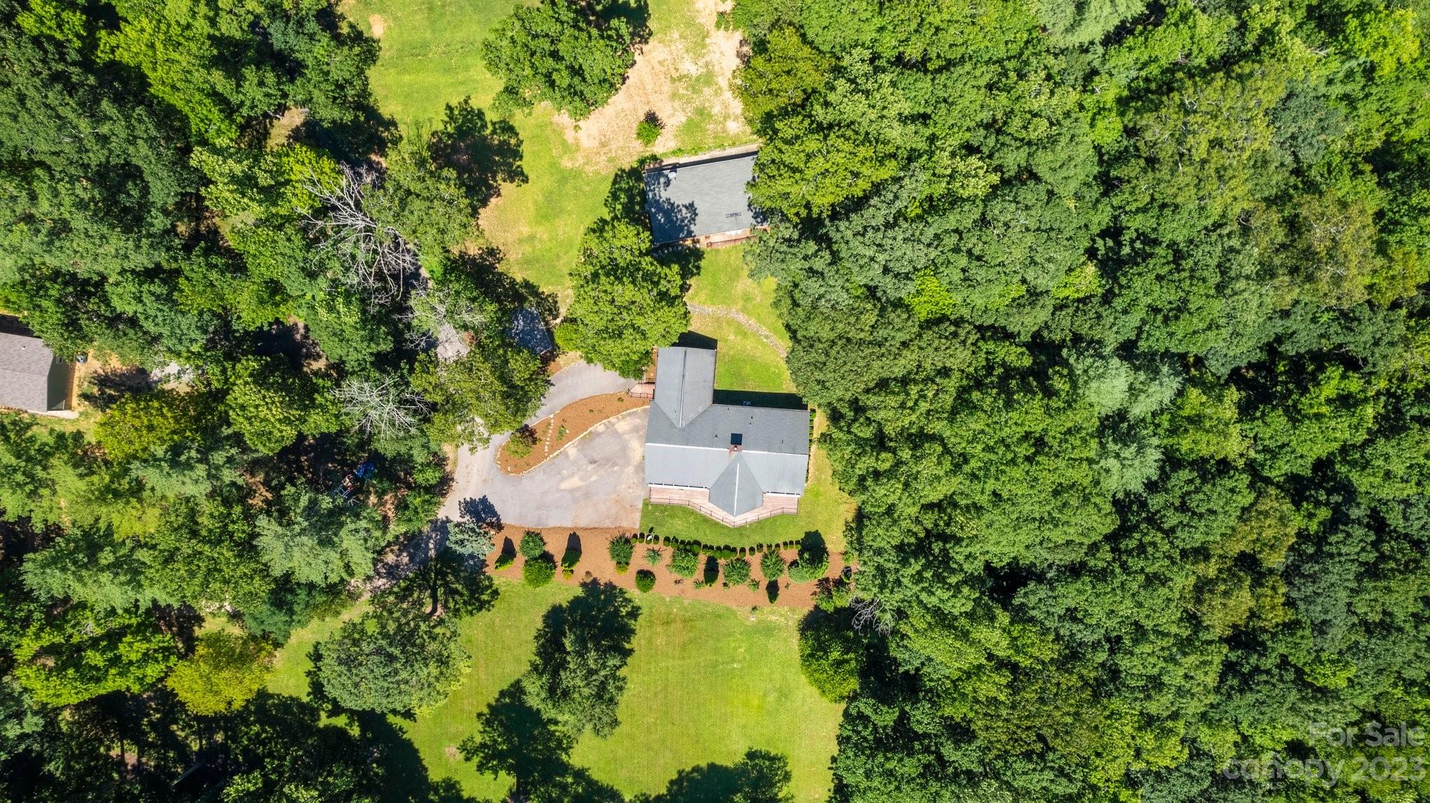 188 White Oak Gap Road Asheville, NC 28803 - Photo 5 of 48 an aerial view of a house with swimming pool and garden