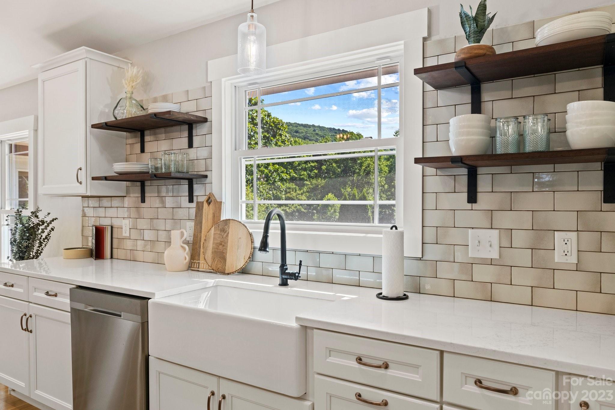 188 White Oak Gap Road Asheville, NC 28803 - Photo 8 of 48 a kitchen with a sink and a window