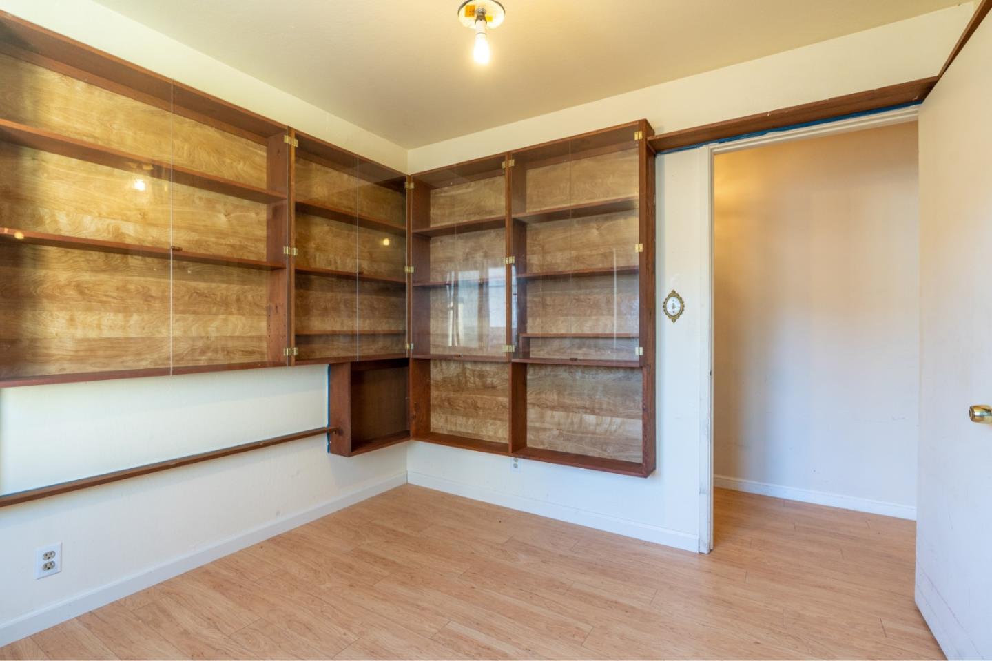 1139 Peralta Road Pacifica, CA 94044 - Photo 16 of 23 a view of a room with wooden floor and a window