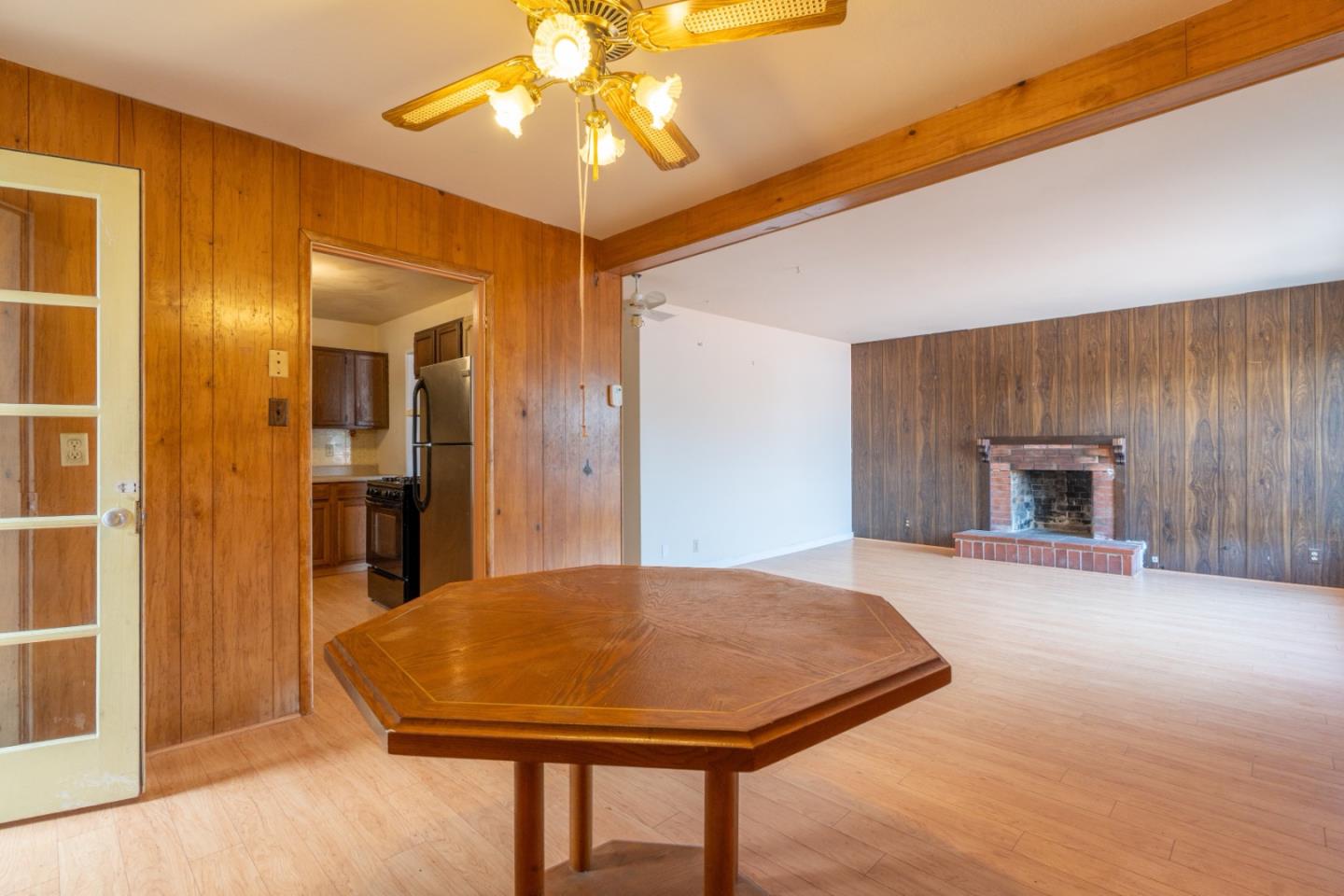 1139 Peralta Road Pacifica, CA 94044 - Photo 9 of 23 a view of a livingroom with a chandelier furniture and a kitchen
