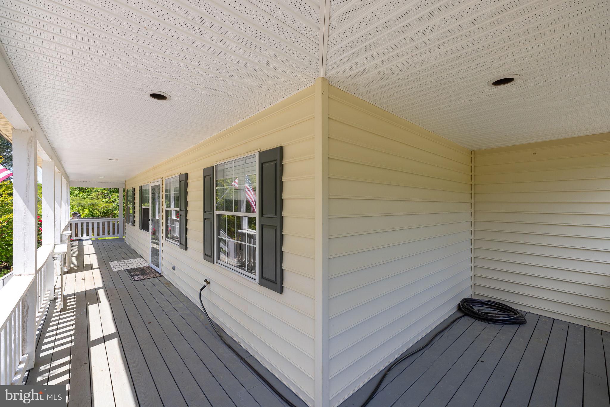2024 Mt Olive Road Beaverdam, VA 23015 - Photo 6 of 74 Sitting area on the side of the sittin'' porch