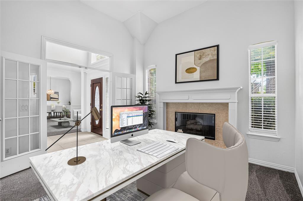 111 Ripplewood Coppell, TX 75019 - Photo 4 of 34 EXECUTIVE Office space featuring a fireplace with a tile surround and white mantel, tall ceilings, and French doors