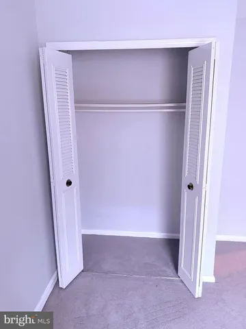 a white toilet sitting next to a shower curtain
