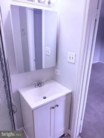 a bathroom with a shower and a toilet